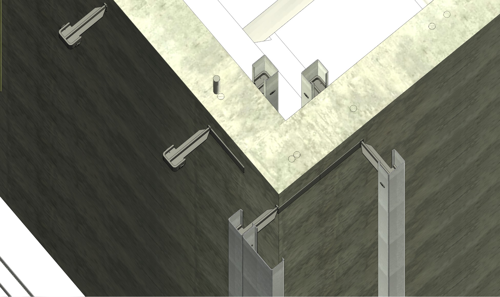 Under-slab view — spikes seated in cast-in hardware, studs threaded on, California corner